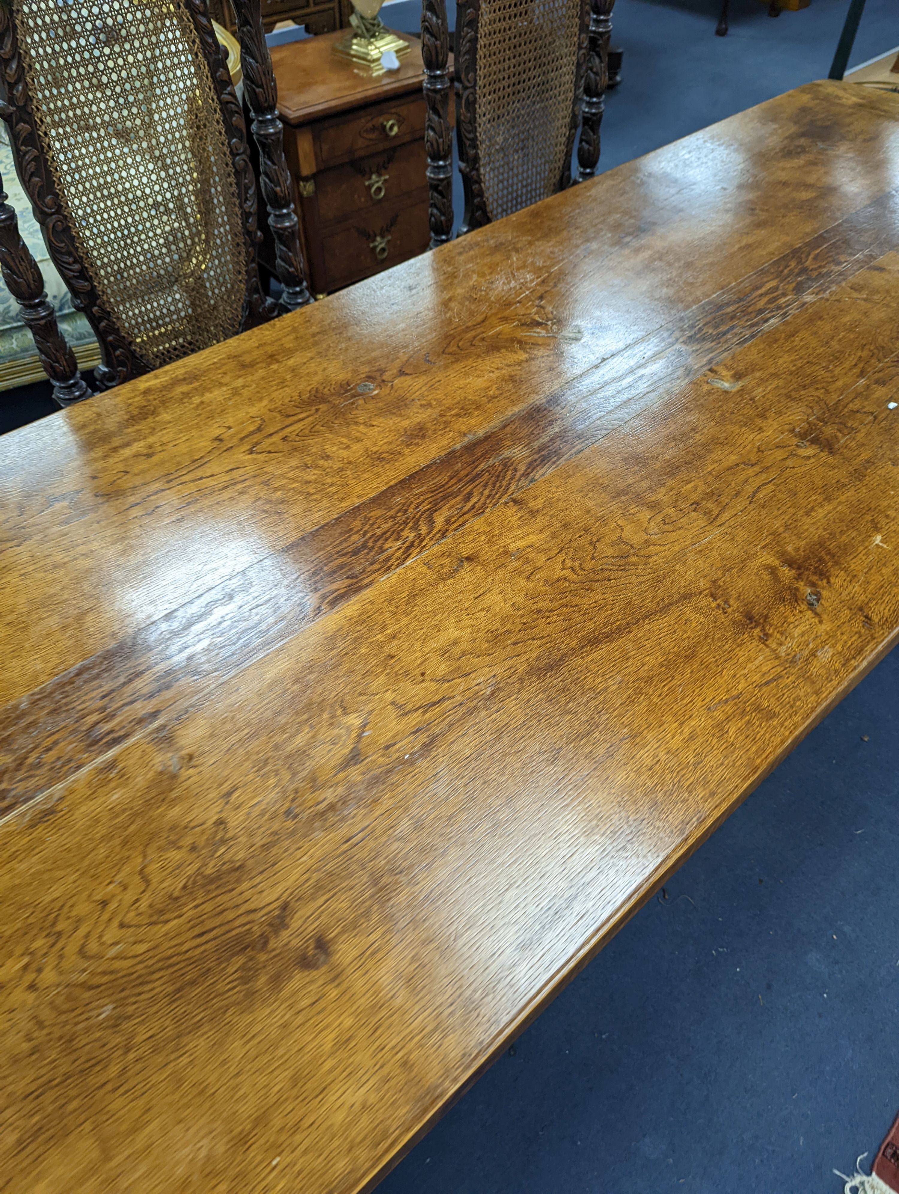 An 18th century style rectangular oak refectory dining table with central stretcher, length 230cm, depth 80cm, height 74cm